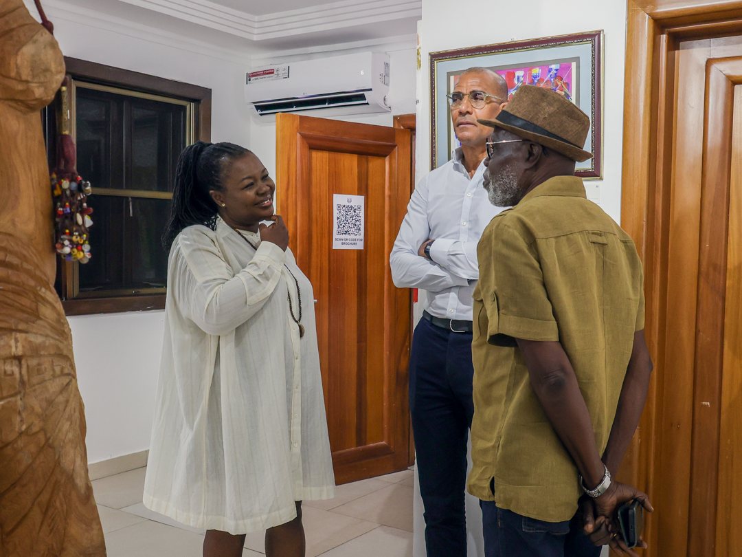 Guests talking by the gallery entrance